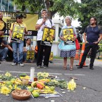 Demonstrators holding up signs defending the Santa Marta 5