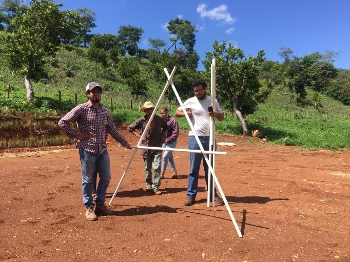 ADES staff prepare the grounds for the Dora Alicio School Farm project