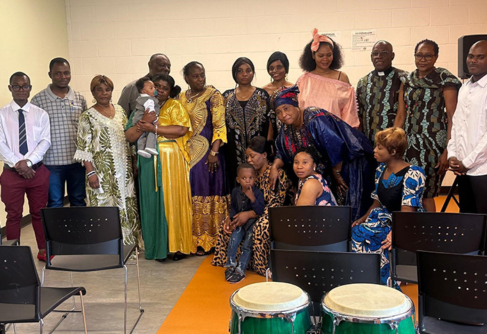 Members of the Emmanuel United Methodist Church congregation with the Rev. Dr. Junior Smith of Trinity United Church in Ottawa