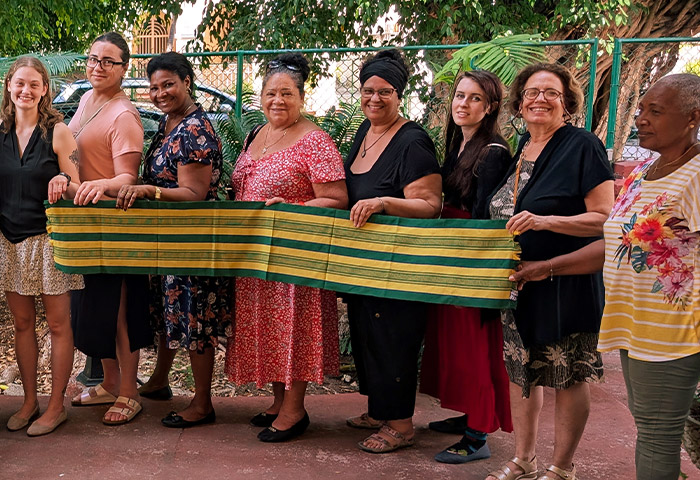 A group of people holding a banner