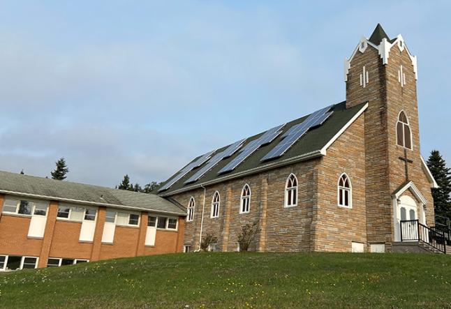 Wawa United Church with solar panels in shape of a crosses