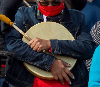 Mi’kmaq drummer pauses during prayer