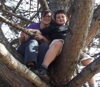 Trisha Elliott and her son Aidan are up in a tree.