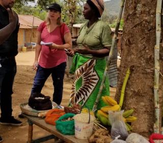 Margaret Tusz-King speaks with a farmer in Kenya