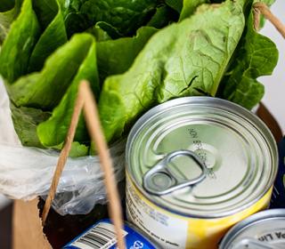 Various food items in a grocery bag.