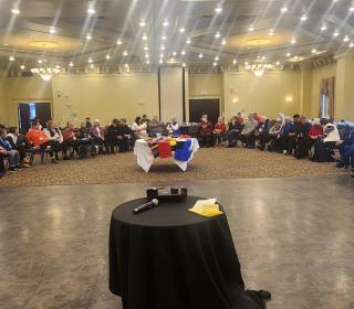 Attendees to the National Indigenous Spiritual Council sit in the closing circle