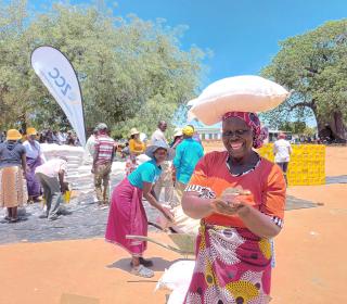 A woman receives food assistance in Zimbabwe