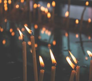 Multiple candles remind us to pray.