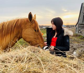 A woman with a horse in the equine therapy program