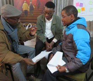 Participants in the Faith Beyond Borders workshop speaking together