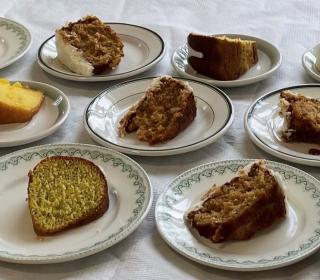 A table with plates of cake