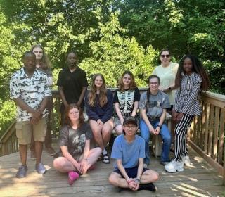Youth climate motivators pose together outside.