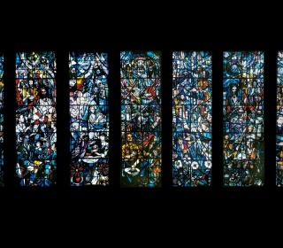 A wall featuring a seven-panel stained glass-window