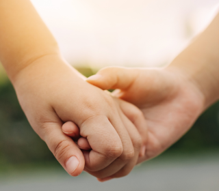 Two hands clasped together