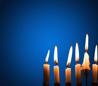 Candles burning with a blue background