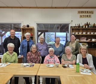 A group of smiling adults in a meeting room