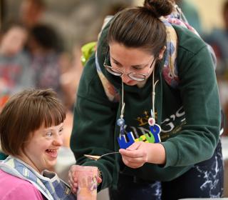 A volunteer and camper at Pearce Williams Summer Camp Retreat 