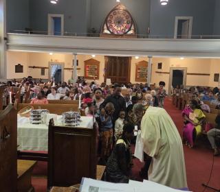 A group of children being baptised in a church