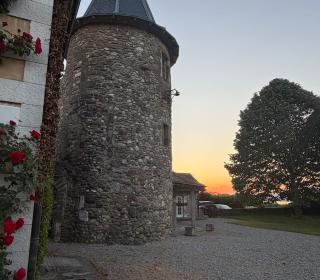 A medieval spire lit by sunset