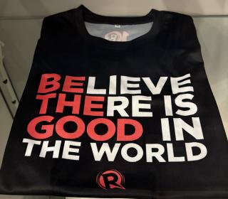 A t-shirt that reads "Believe there is good in the world"