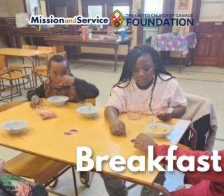 A family eating breakfast in a church setting