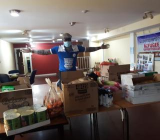 At Beaconsfield United Church, Adedeji prepares to deliver food to newcomers.