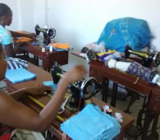 Haitians sew face masks during COVID-19.