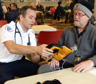 A client receives medical treatment at Our Place, Victoria, BC.