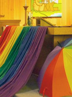 Pride flag and umbrella in sanctuary