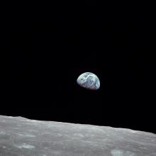 A picture of the Earth rising as seen from the Moon.