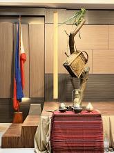 An altar draped in cloth and objects from the Philippine culture