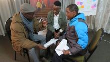 Participants in the Faith Beyond Borders workshop speaking together