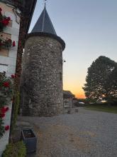 A medieval spire lit by sunset