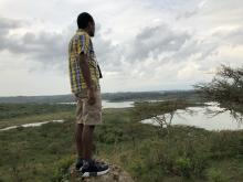 The author Adam Kilner looking out over the Tanzanian landscape.