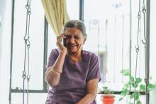 Elderly woman on the phone, laughing