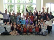 The Australian and Canadian members of the Dialogue on Reconciliation gather and wave to the camera.