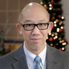 A photograph portrait of Rev. Dr. Alan Lai.