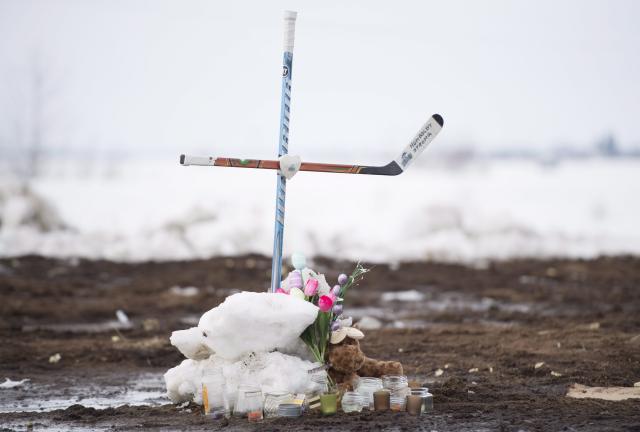 A hockey stick cross stands at the site of the Humboldt Broncos crash.