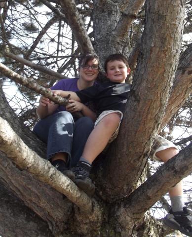 Trisha Elliott and her son Aidan are up in a tree.