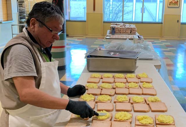Man making sandwiches.