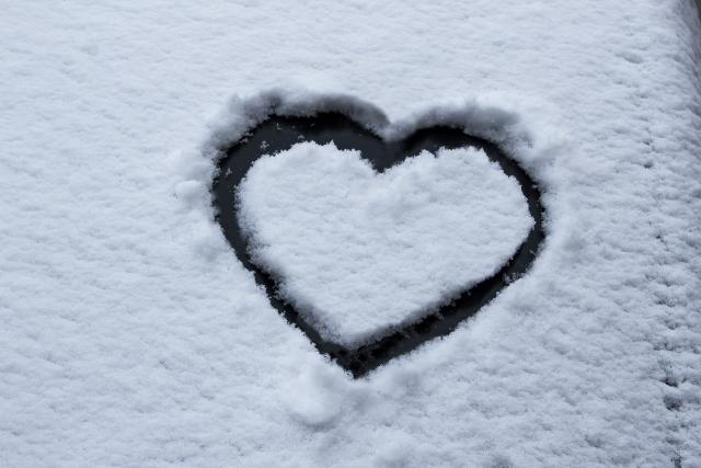 a heart drawn in snow