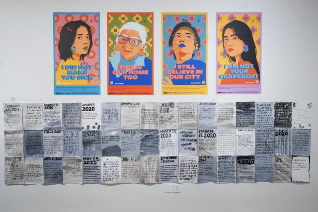 Posters to combat Asian hate on display at New York City's Chinatown Museum. 