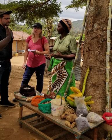 Margaret Tusz-King speaks with a farmer in Kenya