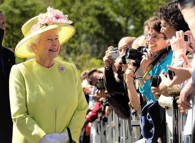 Queen Elizabeth greets onlookers at an event