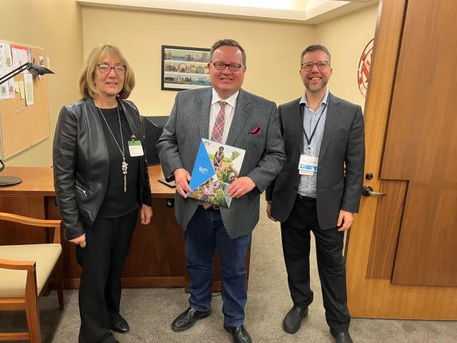 The Hunger on the Hill advocates pose with their MP.