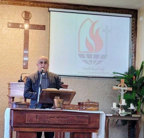 The Rev. Danny Awad preaching at Baraka Presbyterian Church in Palestine.