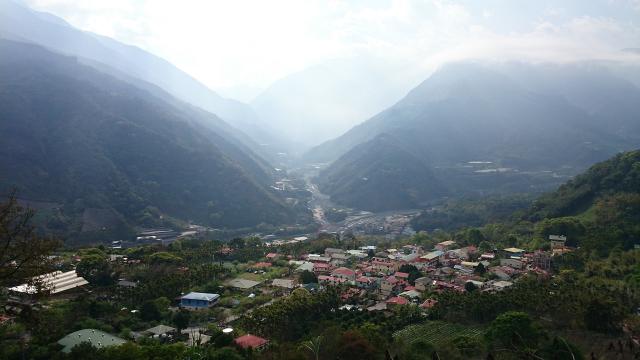 A small mountain village, with one main street, seen from an aerial view.