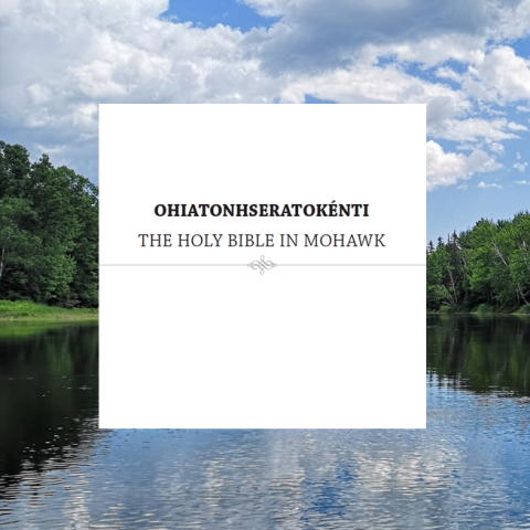 OHIATONHSERATOKÉNTI THE HOLY BIBLE IN MOHAWK in a white box against a river landscape