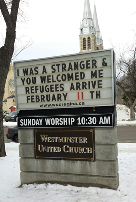 The sign outside Westminster United Church says "I was a stranger and you welcomed me. Refugees arrive February 11."