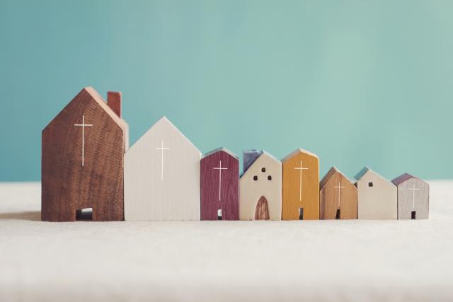 A model of a neighbourhood with a church building. Made of wooden blocks